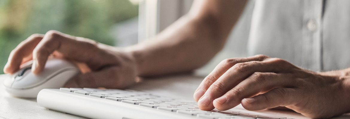 man using tablet searching for personal excess liability insurance