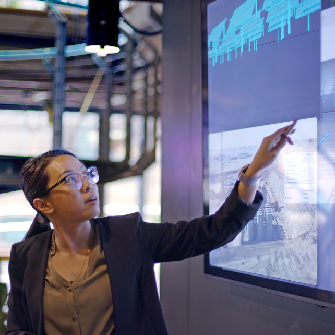 Woman viewing information on an interactive screen