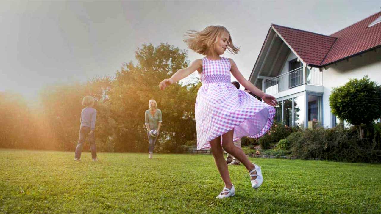 family playing outdoors at home