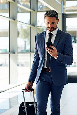 male walking through airport on business trip