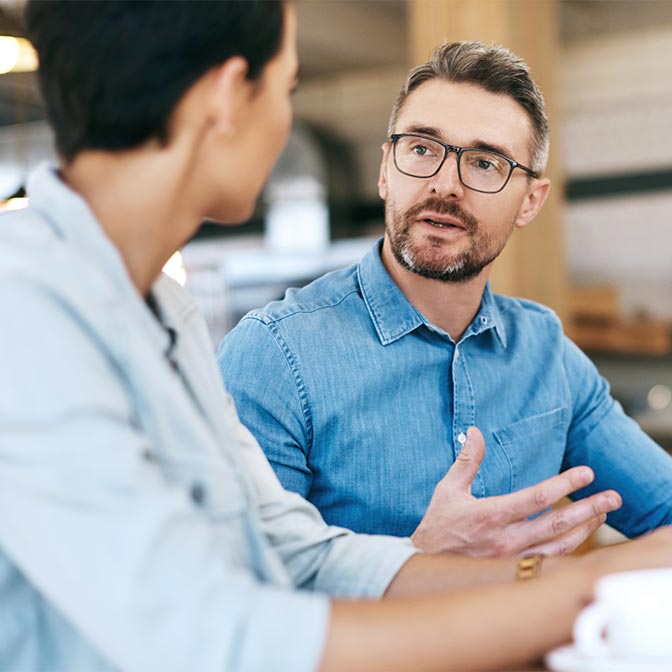 a man and a woman discussing