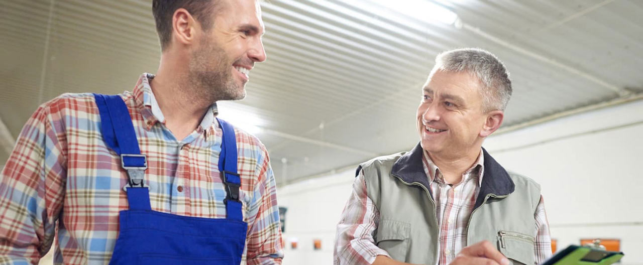 farm workers smiling at each other