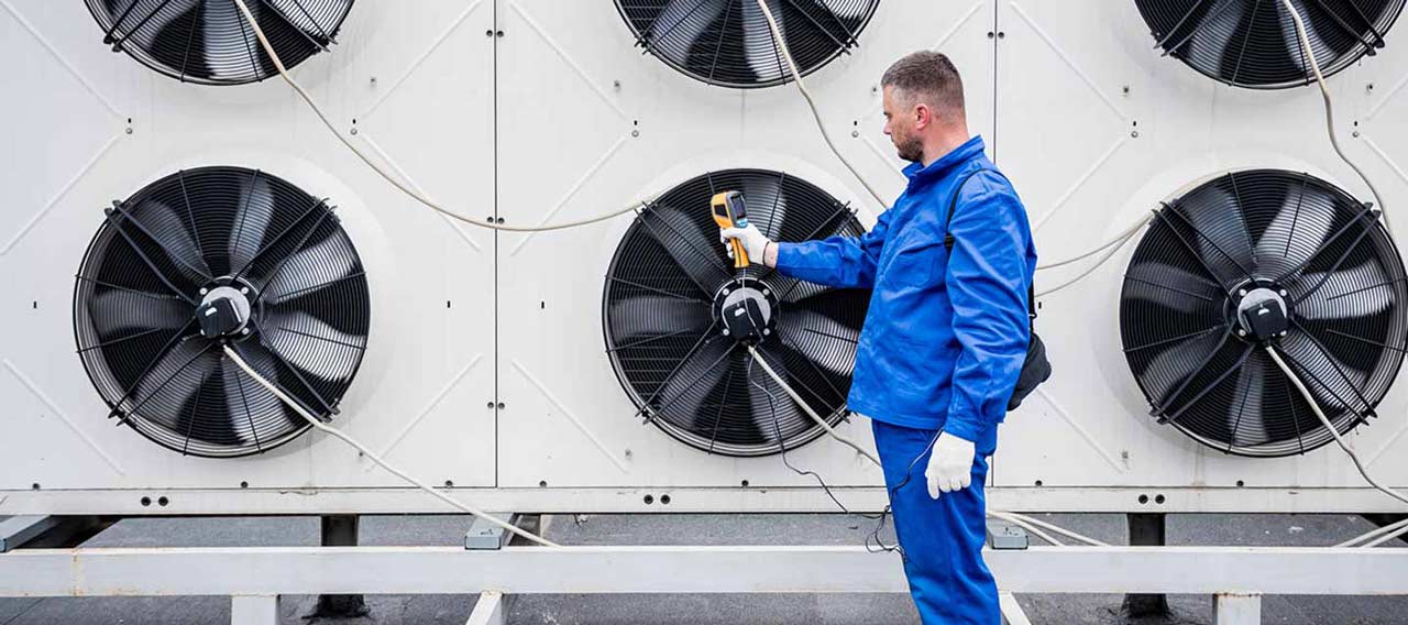 technician next to fans