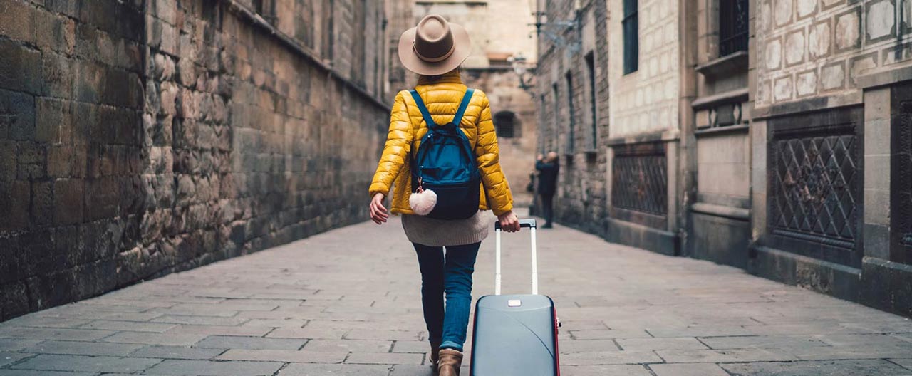 woman walking with luggage