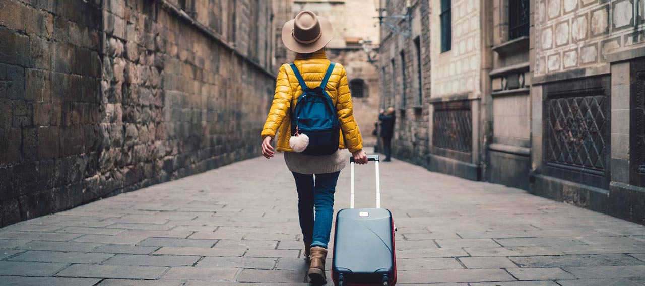 woman walking with luggage