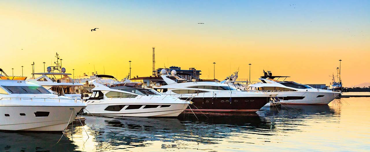 boats at marine and sunset behind