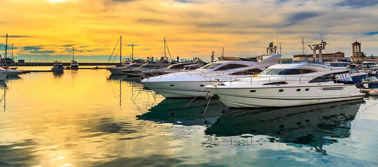 luxury yachts at sunset